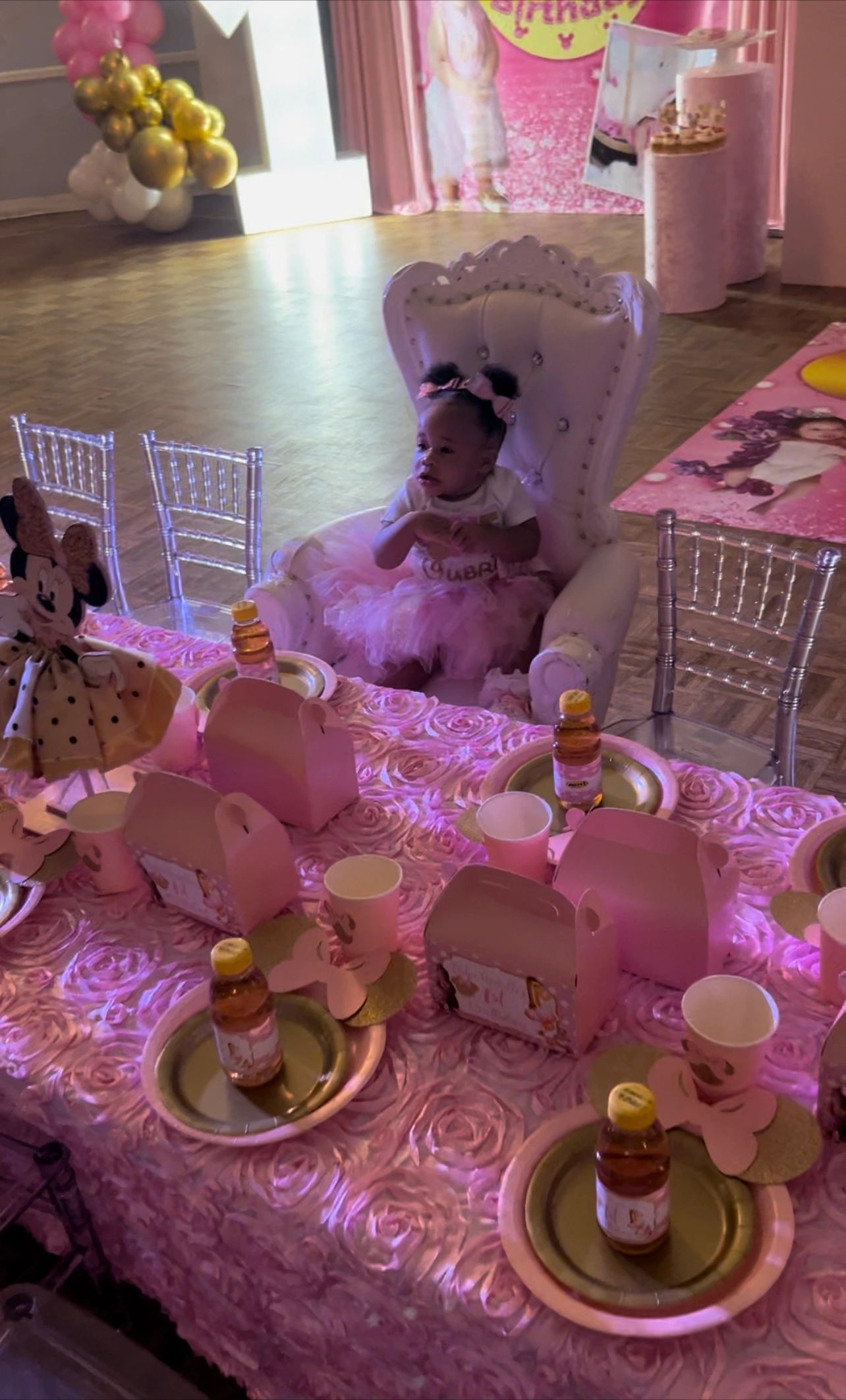 Luxurious pink-themed party with throne chair and gold accents